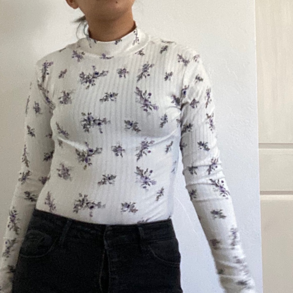 A white and flower long sleeve shirt